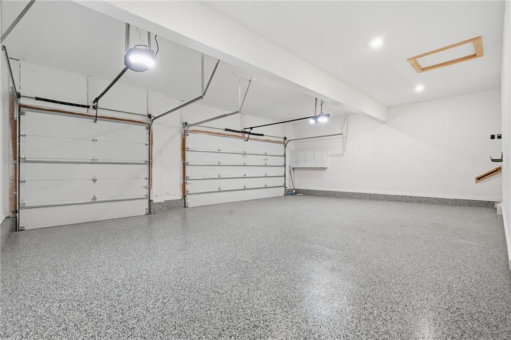 Epoxy garage floor and attached garage at 1 S Buffalo Ridge Court, Lake Winnebago, MO 64034