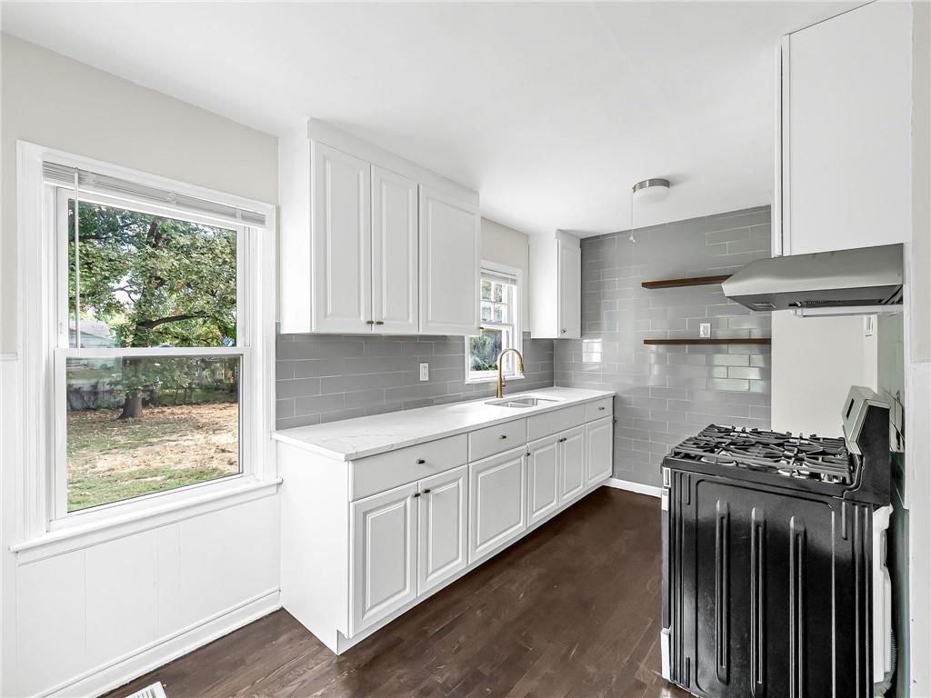 White kitchen, shaker cabinets and updated kitchen at 2221 N 36th Street, Kansas City, KS 66104