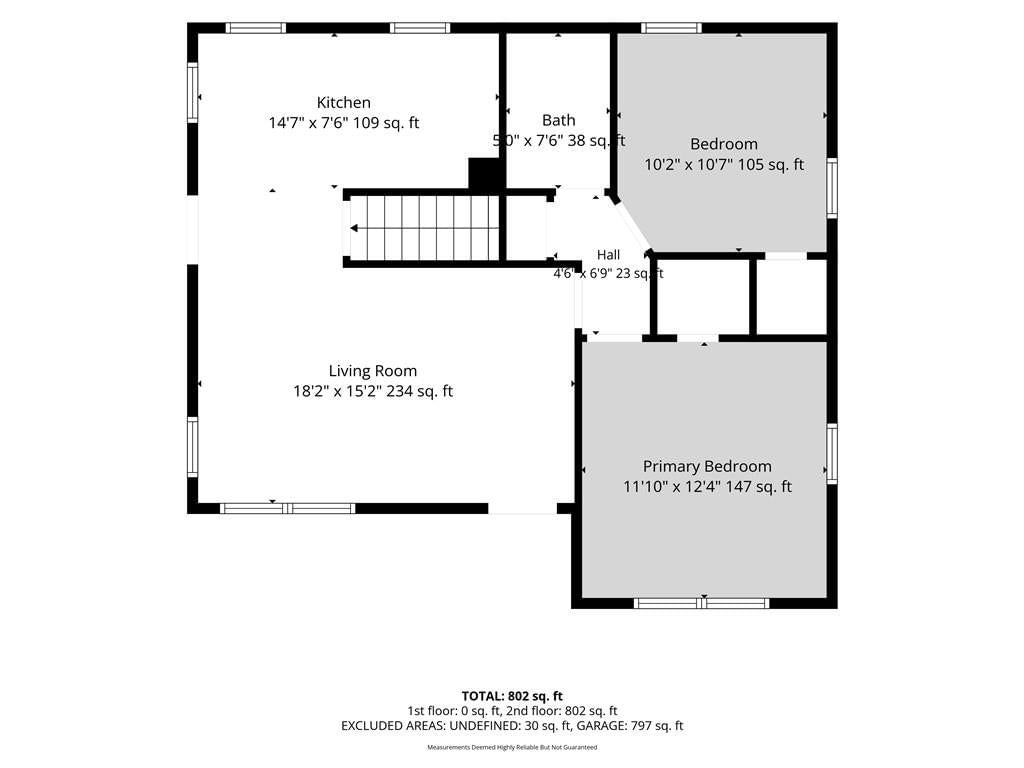 Main-floor primary bedroom and staircase at 2221 N 36th Street, Kansas City, KS 66104