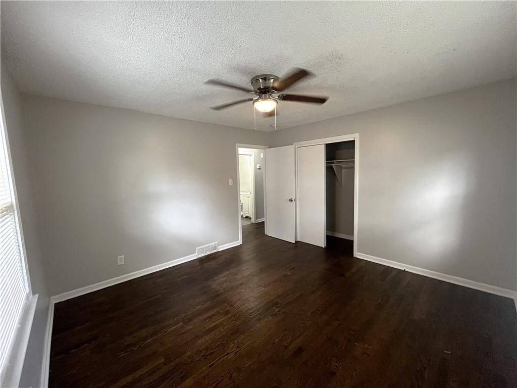 Main-floor primary bedroom at 7416 Montgall Avenue, Kansas City, MO 64132