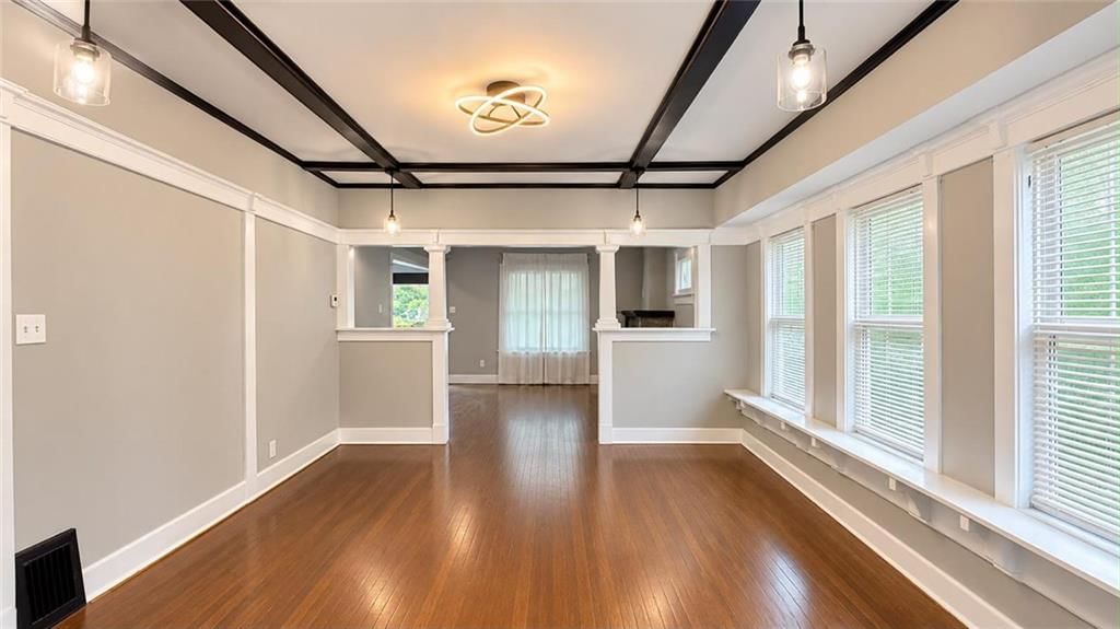 Statement lighting and ceiling beams at 3942 Flora Avenue, Kansas City, MO 64110