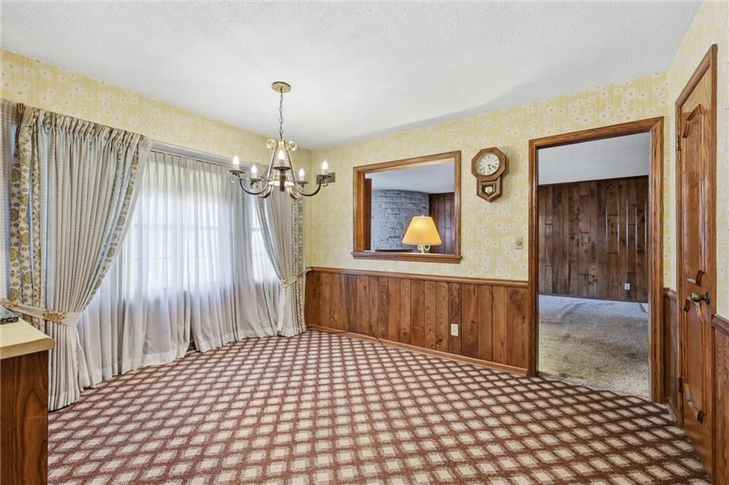 Tile floors, wall of windows and built-ins at 9209 W 47th Street, Merriam, KS 66203