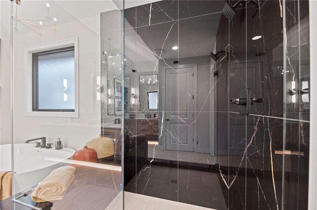 Walk-in shower, tiled shower and frameless glass shower at 17605 Carter Street, Overland Park, KS 66221