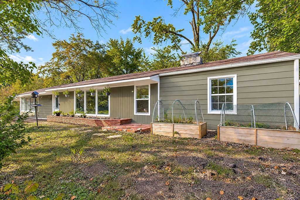 Big backyard, fenced yard and mature trees at 622 Walnut Street, Liberty, MO 64068
