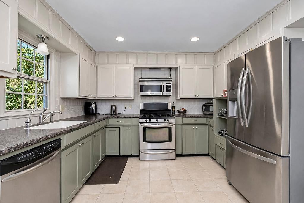 Shiplap / paneling and kitchen backsplash at 622 Walnut Street, Liberty, MO 64068