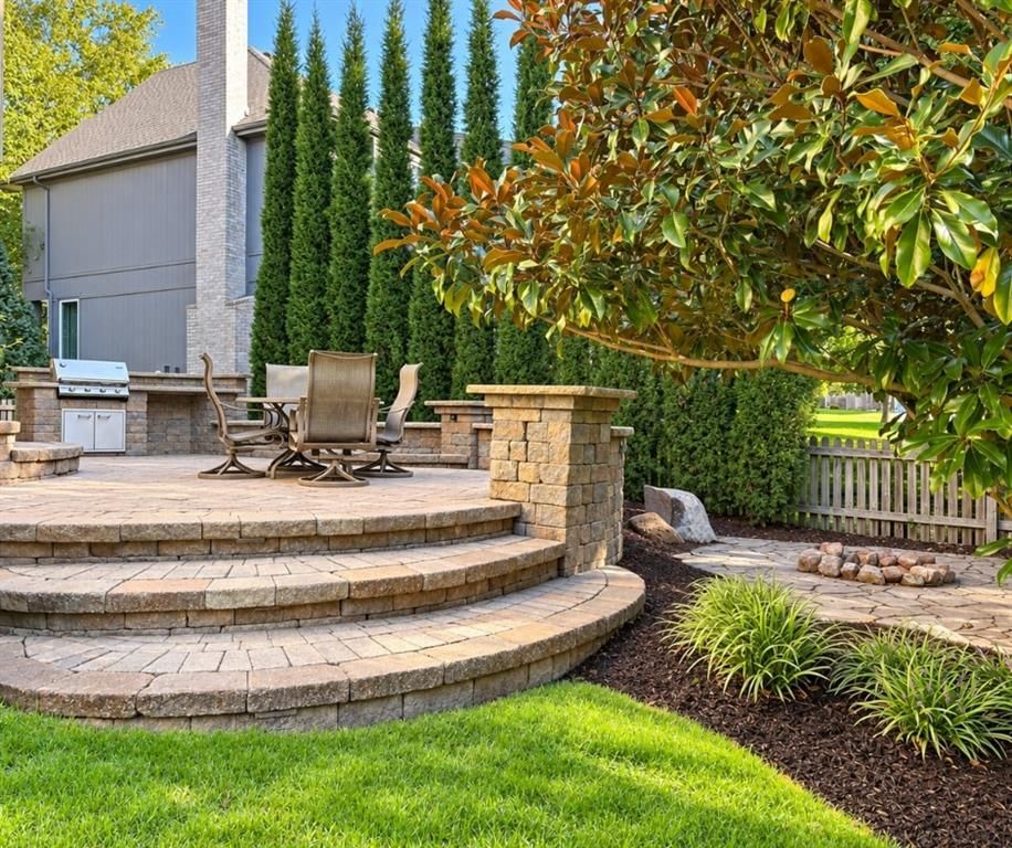 Big backyard, fenced yard and outdoor fireplace at 12824 GRANT Street, Overland Park, KS 66213
