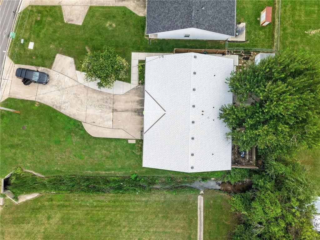 Pond or creek visible on the lot at 123 E Madison Street, Gardner, KS 66030