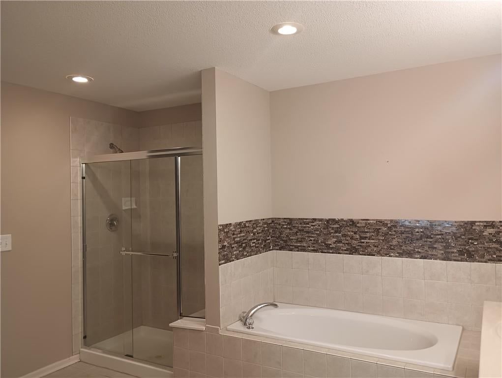 Walk-in shower and tiled shower at 14121 W 152nd Terrace #4003, Olathe, KS 66062