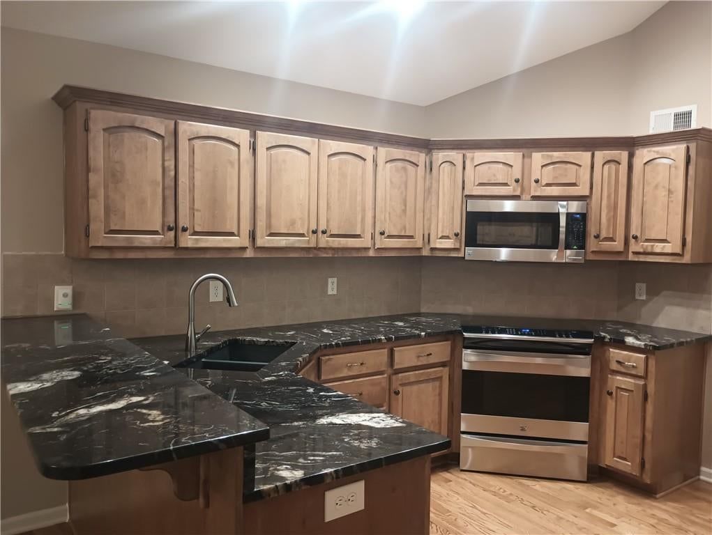 Stainless steel appliances and electric range at 14121 W 152nd Terrace #4003, Olathe, KS 66062