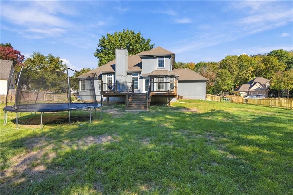 Big backyard, fenced yard and mature trees at 18107 E 51st Street Court, Independence, MO 64055