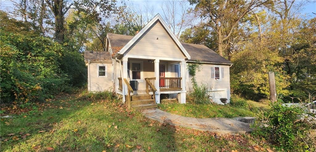 Brown roof and siding exterior at 4038 N Cleveland Avenue, Kansas City, MO 64117