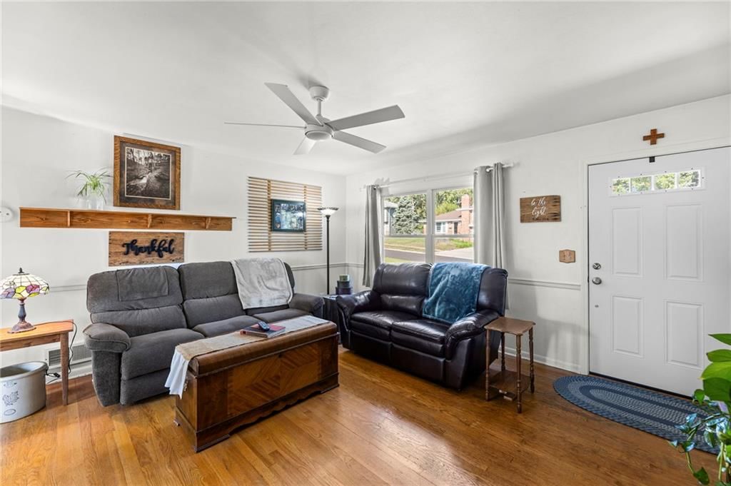 Open floor plan, hardwood floors and wall of windows at 8809 W 94th Street, Overland Park, KS 66212