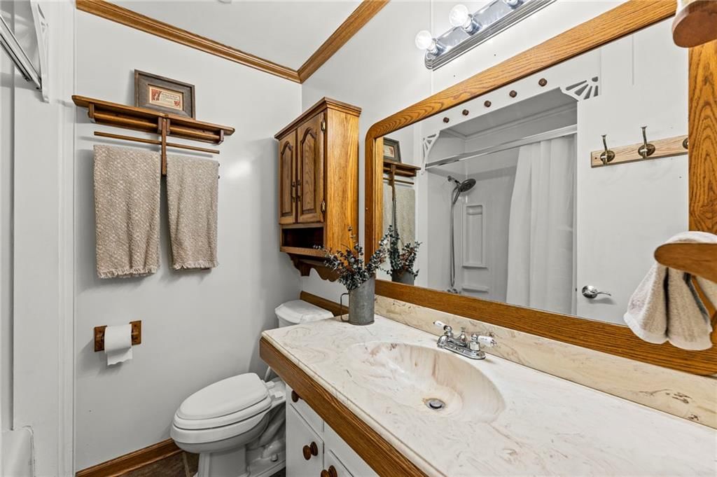 Tiled shower, double vanity and renovated bathrooms at 8809 W 94th Street, Overland Park, KS 66212
