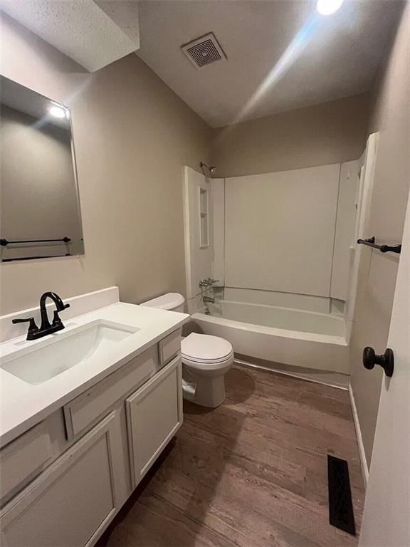 Tiled shower, double vanity and white vanity at 4316 Jarboe Street, Kansas City, MO 64111