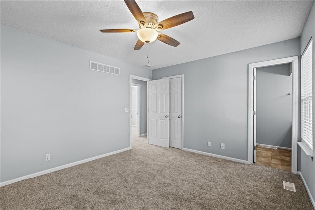 Gray walls and carpet at 1122 E Frontier Drive, Olathe, KS 66062
