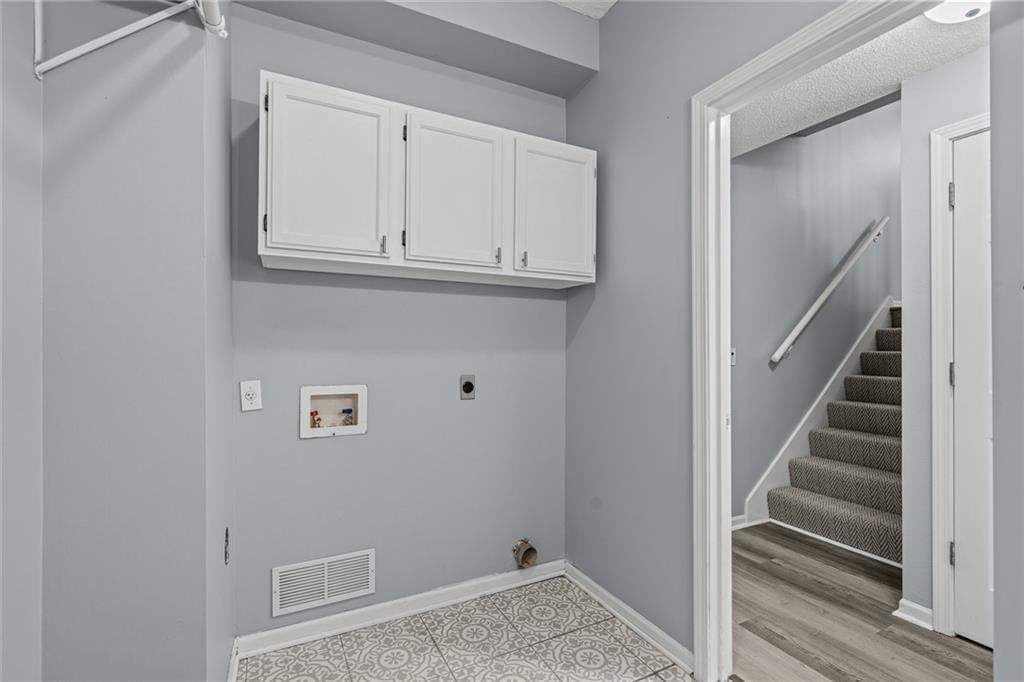 Laundry cabinets at 1122 E Frontier Drive, Olathe, KS 66062