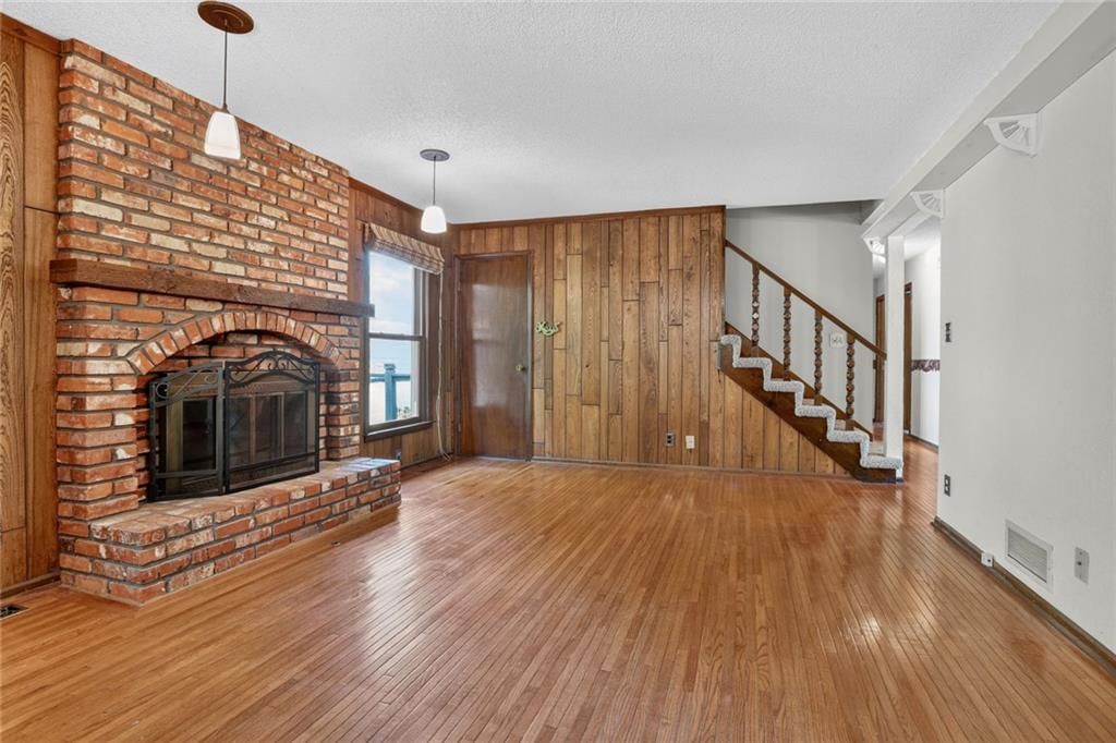 Staircase and wood stair railing at 1528 NE 99th Street, Kansas City, MO 64155