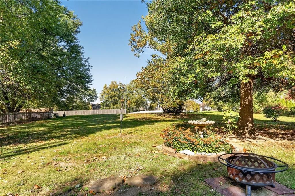 Big backyard, fire pit and flat lot at 1528 NE 99th Street, Kansas City, MO 64155