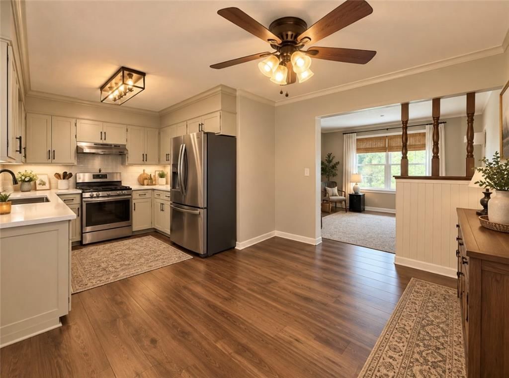 Open floor plan, white kitchen and quartz counters at 15400 37th Terrace S, Independence, MO 64055