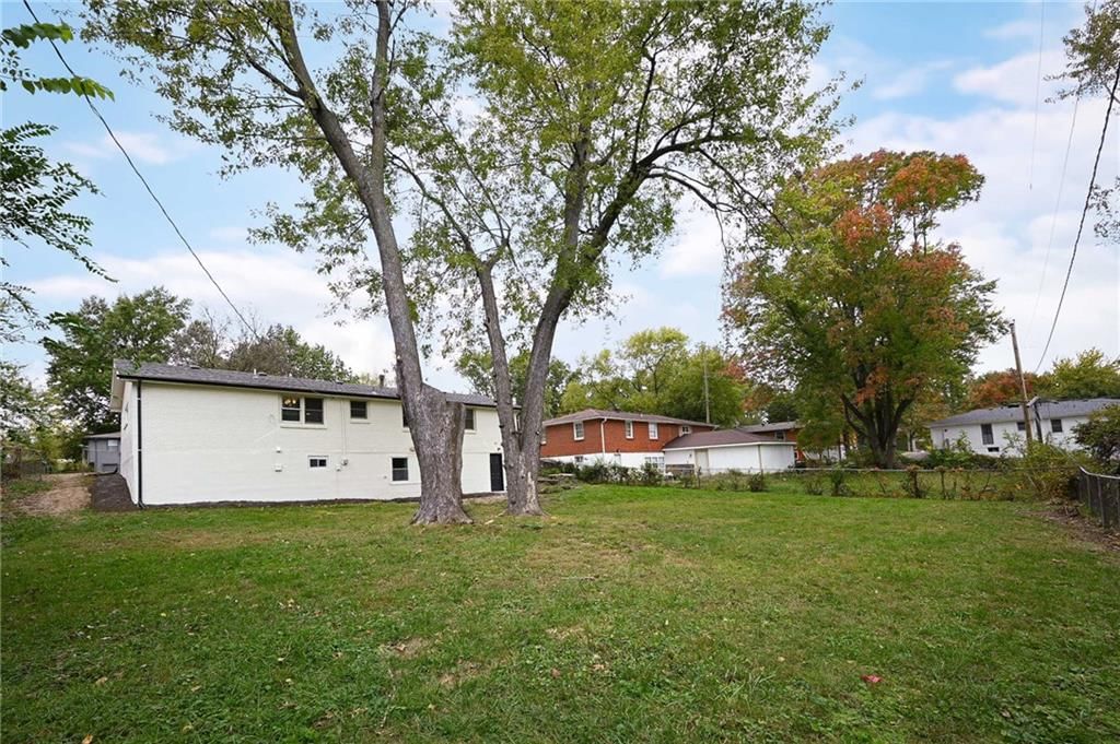 Big backyard, mature trees and flat lot at 6813 N Tracy Avenue, Gladstone, MO 64118