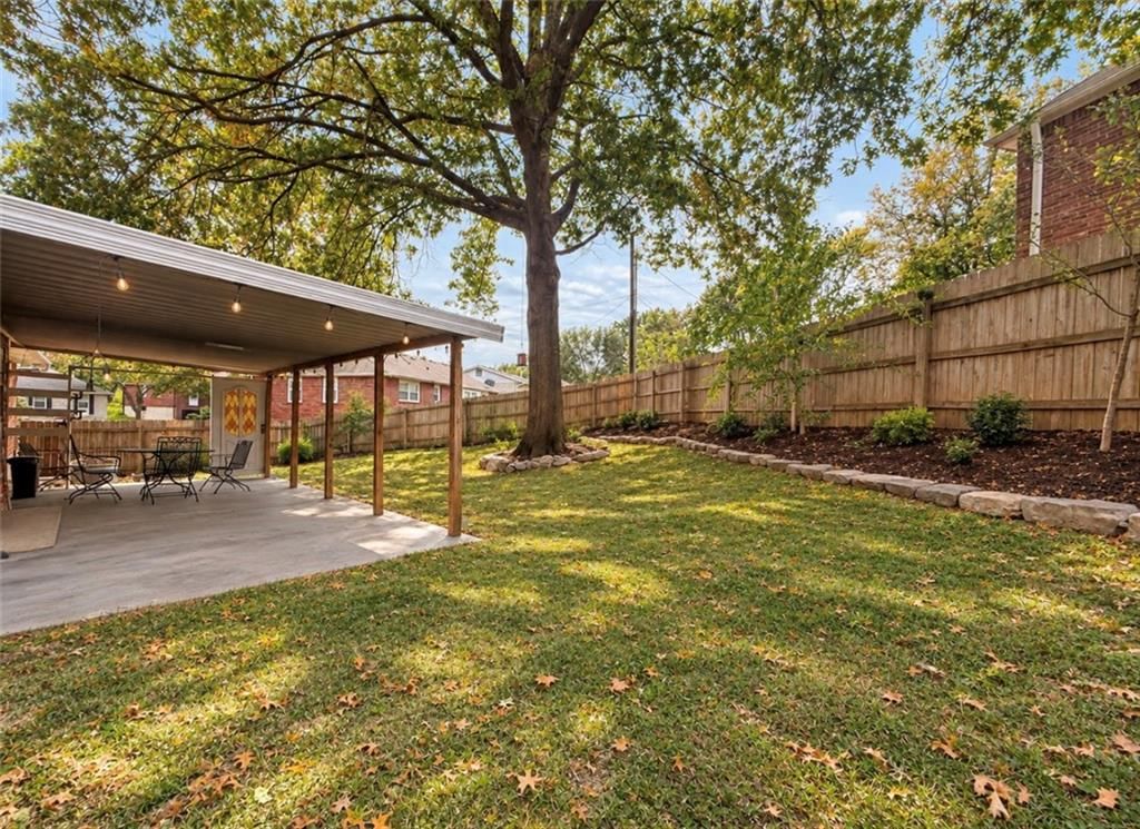 Big backyard, fenced yard and covered patio at 15109 E 40th Street S, Independence, MO 64055