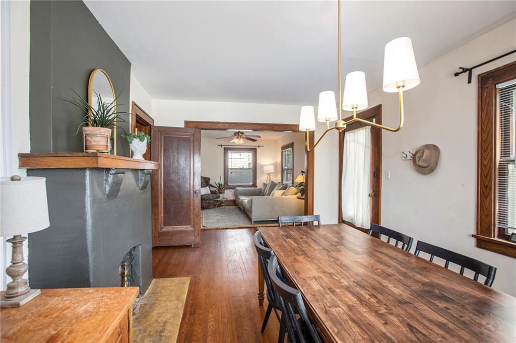 Open floor plan, statement lighting and accent wall at 4346 Campbell Street, Kansas City, MO 64110