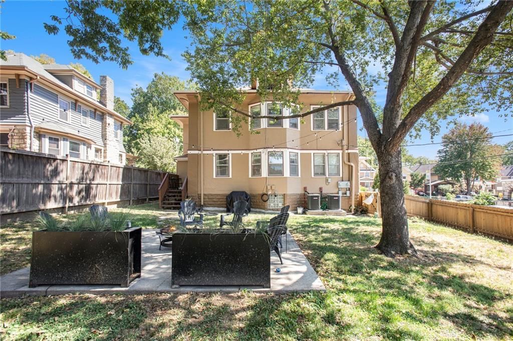 Fenced yard and mature trees at 4346 Campbell Street, Kansas City, MO 64110