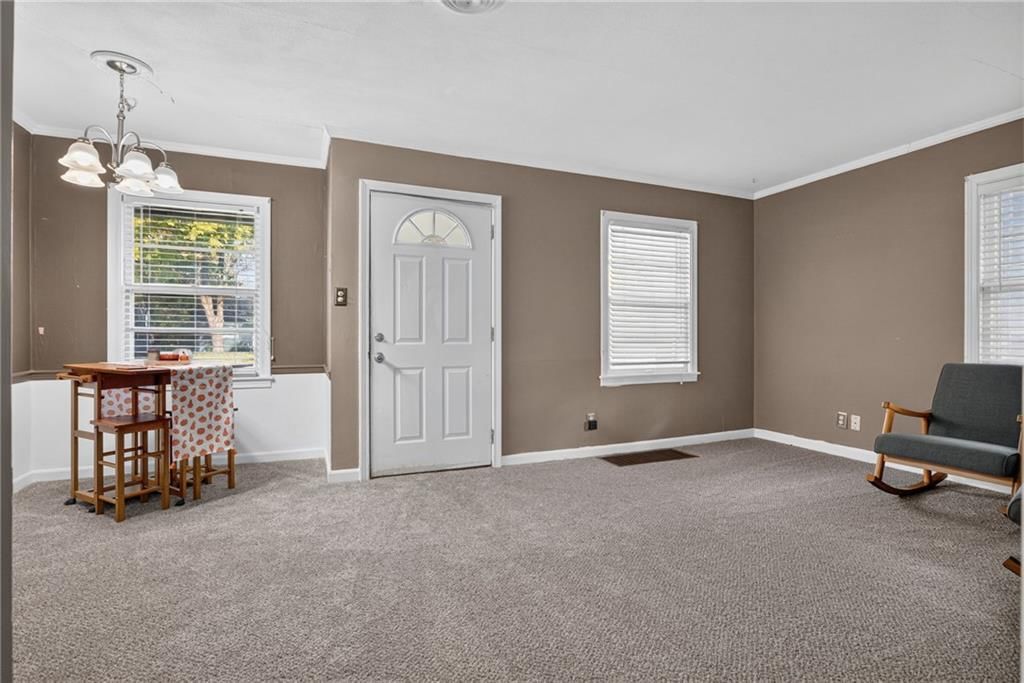 Wall of windows, white trim and greige walls at 611 W 85th Street, Kansas City, MO 64114