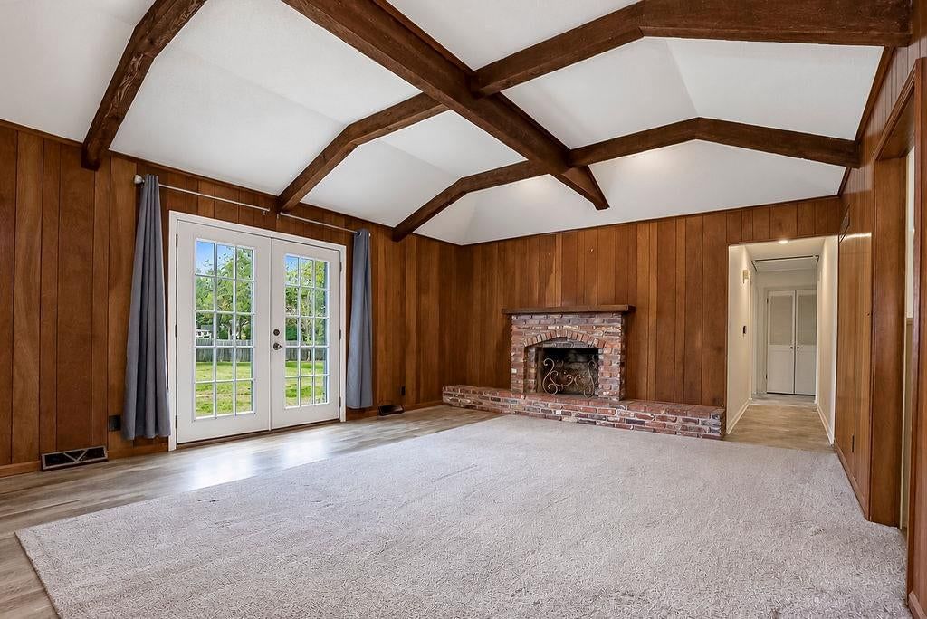 Tall ceilings, fireplace and ceiling beams at 25025 W 143rd Street, Olathe, KS 66061