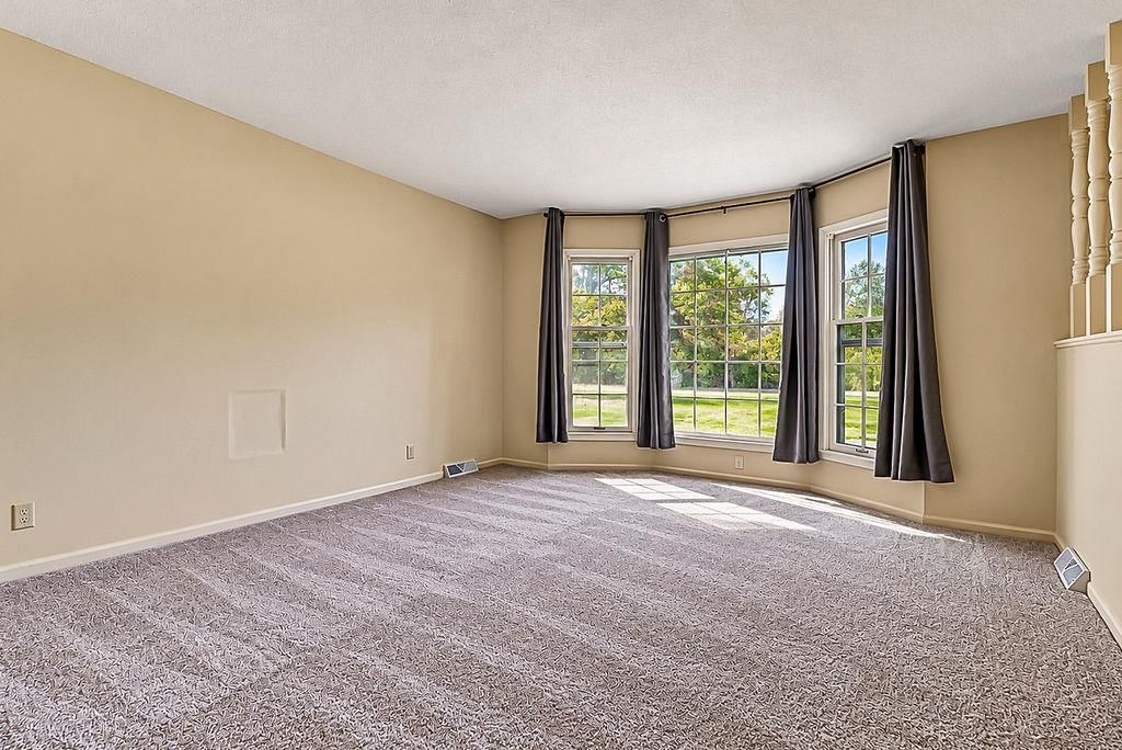 Wall of windows and carpet at 25025 W 143rd Street, Olathe, KS 66061