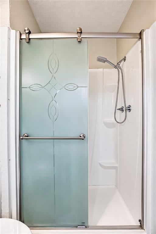 Walk-in shower, tiled shower and frameless glass shower at 25025 W 143rd Street, Olathe, KS 66061