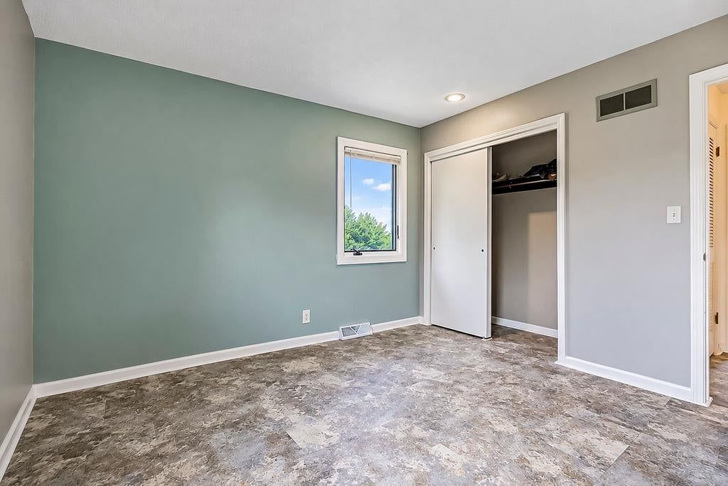 Walk-in closet at 25025 W 143rd Street, Olathe, KS 66061