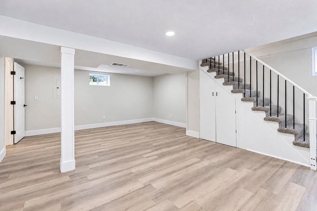 Finished basement and iron stair railing at 3438 N Brighton Avenue, Kansas City, MO 64117