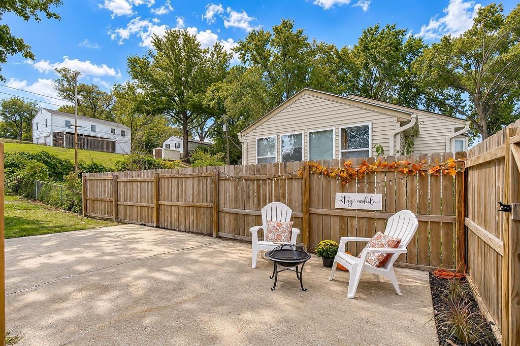 Fenced yard and concrete patio at 3438 N Brighton Avenue, Kansas City, MO 64117