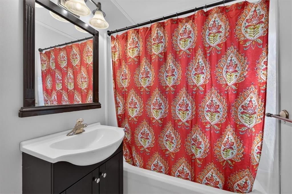 Tiled shower and tub and shower combo at 8016 Robinson Street, Overland Park, KS 66204