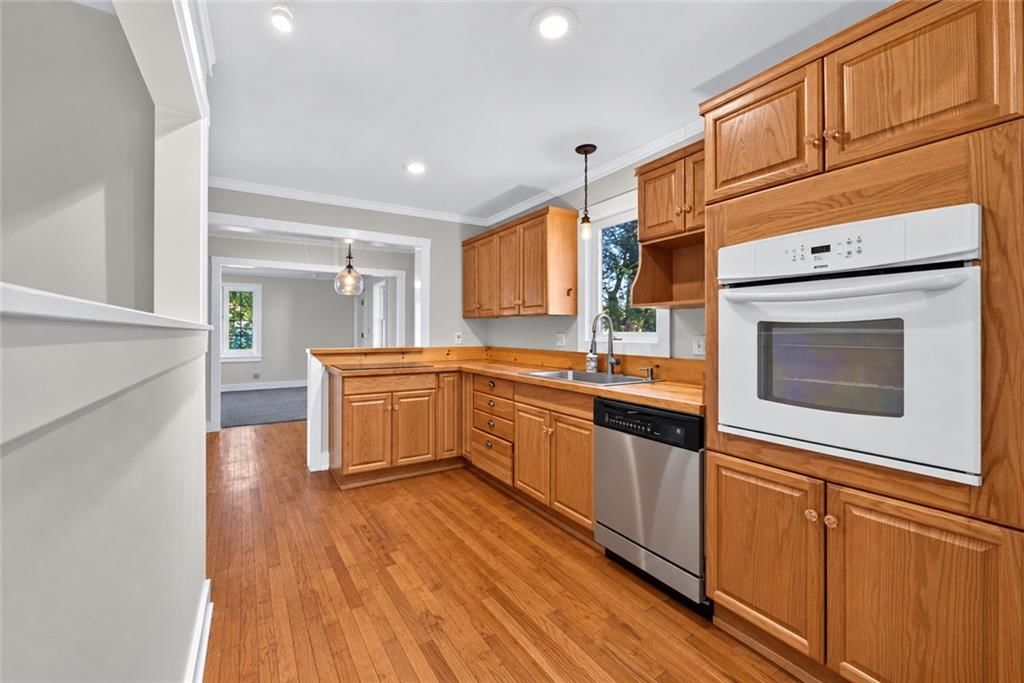 Kitchen island, butcher block countertops and wood kitchen cabinets at 8016 Robinson Street, Overland Park, KS 66204
