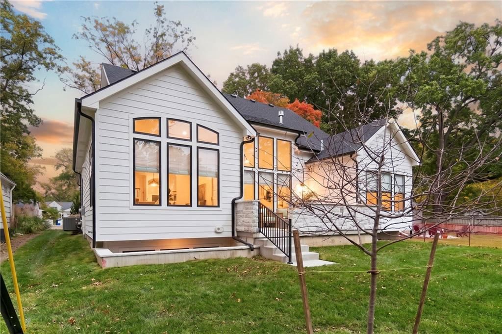 Big backyard and siding exterior at 4905 W 71st Street, Prairie Village, KS 66208