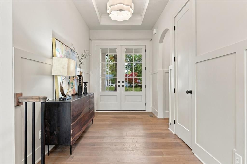 Hardwood floors, recessed lighting and white trim at 4905 W 71st Street, Prairie Village, KS 66208