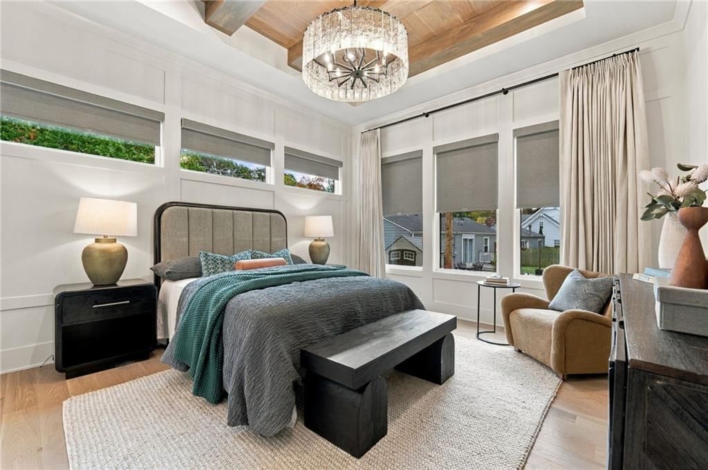 Floor-to-ceiling windows, tray ceiling and bedroom sitting area at 4905 W 71st Street, Prairie Village, KS 66208