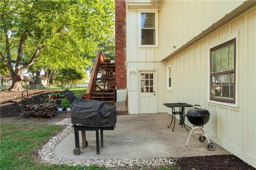 Fire pit and concrete patio at 205 SE Saratoga Drive, Blue Springs, MO 64014