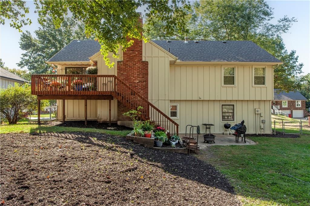 Deck, big backyard and wood deck at 205 SE Saratoga Drive, Blue Springs, MO 64014