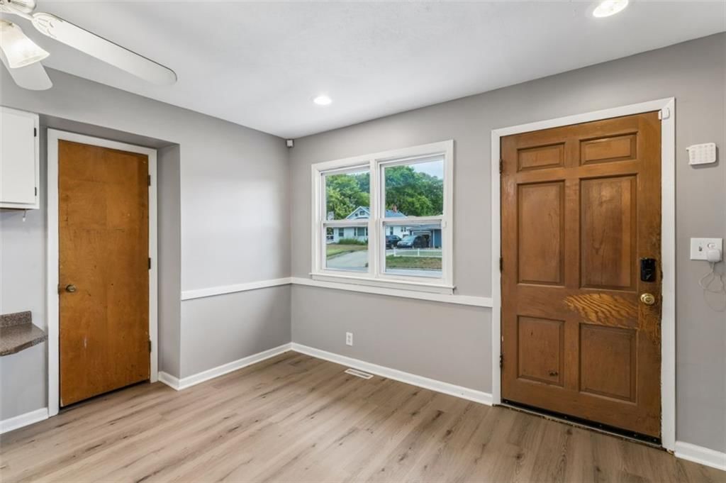 Wainscoting or board and batten, recessed lighting and white trim at 559 E Prairie Street, Olathe, KS 66061