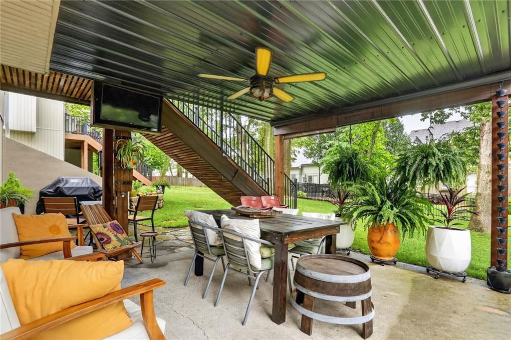 Deck, fenced yard and composite deck at 7710 N Pomona Place, Kansas City, MO 64152