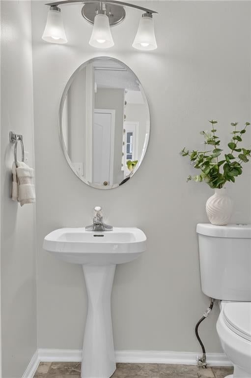 White vanity and renovated bathrooms at 6529 NW Hidden Valley Road, Kansas City, MO 64152