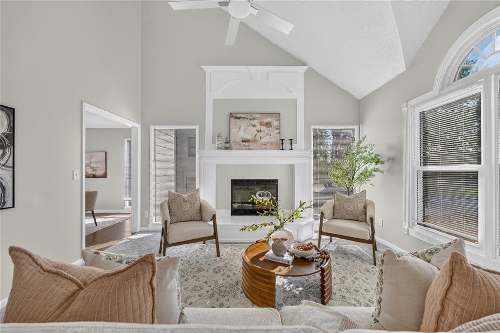 Tray ceiling, wall of windows and tile fireplace at 6529 NW Hidden Valley Road, Kansas City, MO 64152