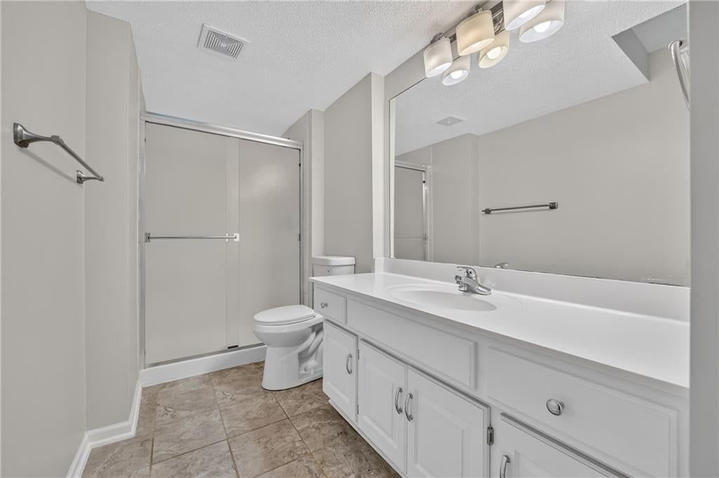 Tile floors and tiled shower at 6529 NW Hidden Valley Road, Kansas City, MO 64152