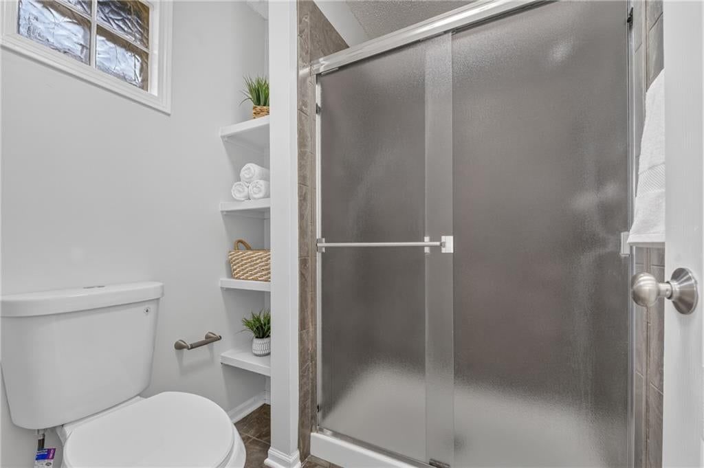 Frameless glass shower at 6529 NW Hidden Valley Road, Kansas City, MO 64152