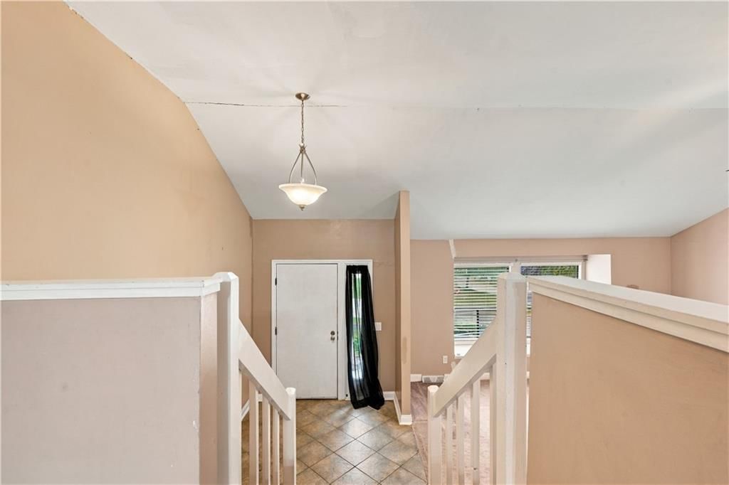 Staircase and wood stair railing at 14624 W 91st Place, Lenexa, KS 66215