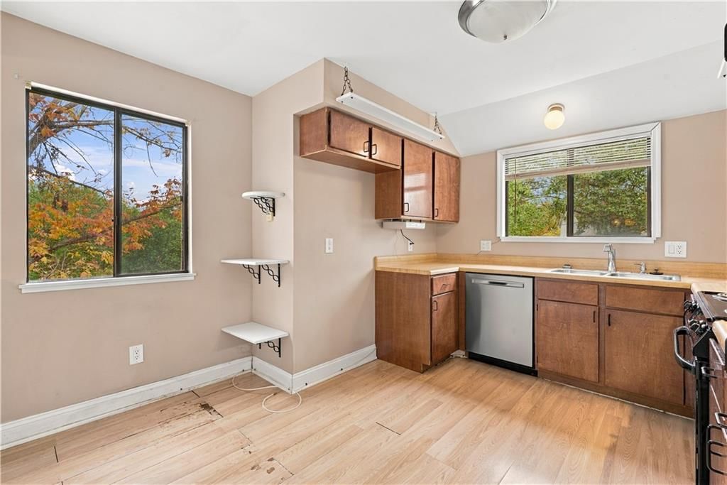 Hardwood floors, butcher block countertops and stainless steel appliances at 14624 W 91st Place, Lenexa, KS 66215