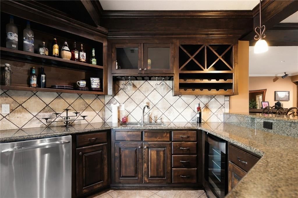 Dark kitchen cabinets at 1205 NW 43rd Terrace, Kansas City, MO 64116